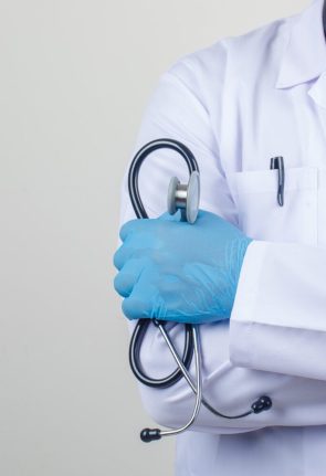 doctor-crossing-arms-while-holding-stethoscope-white-coat